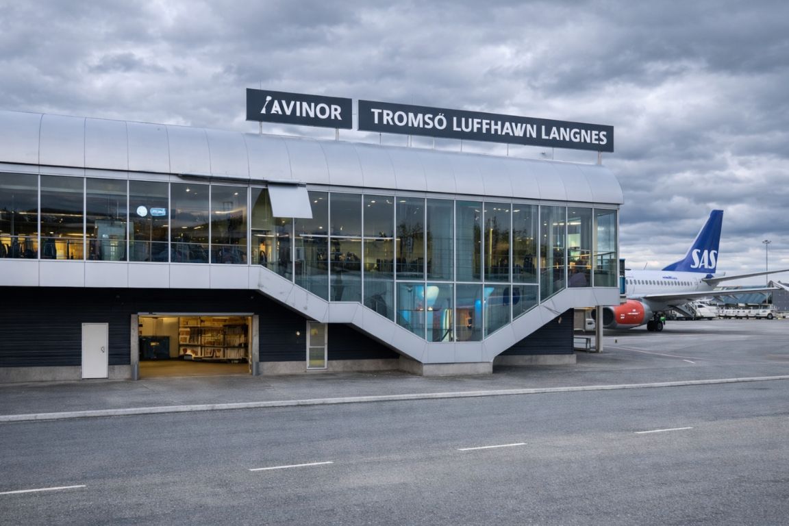 Arrival at Tromsø Airport in Norway as part of a Northern Lights and Arctic adventure tour with Tromso Norway Tours, showing the terminal and aircraft on the tarmac